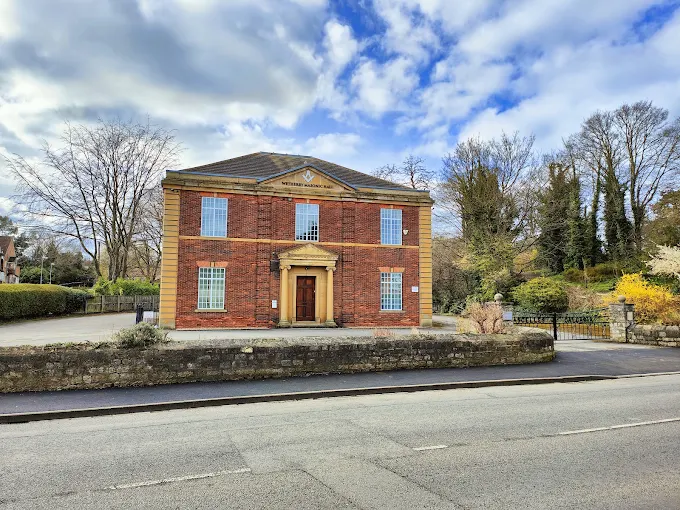 Wetherby Masonic Hall, a red brick Georgian-style building with stone quoins and a pedimented doorway